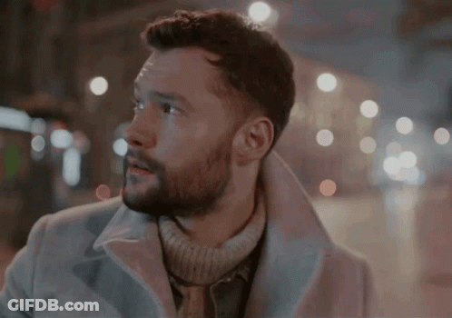 A Man With A Beard Wearing A White Coat GIF