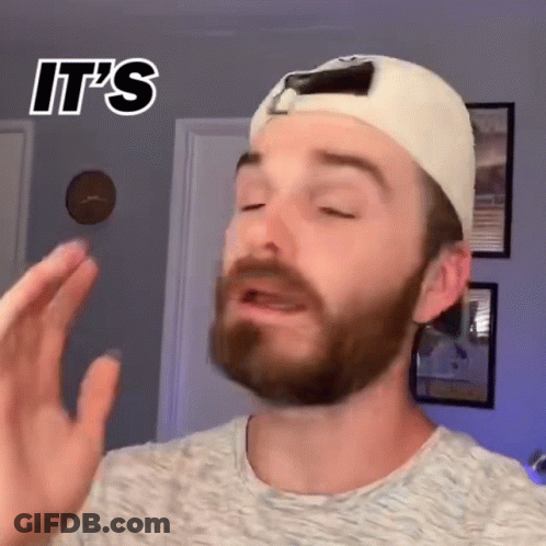 A Man With A Beard Wearing A White Hat And A Grey Shirt Says It 'S .. GIF