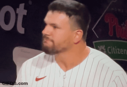 A Man With A Beard Wearing A White Nike Jersey GIF