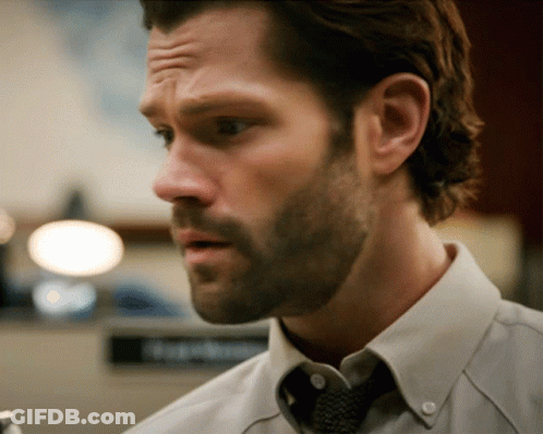 A Man With A Beard Wearing A White Shirt And A Tie GIF
