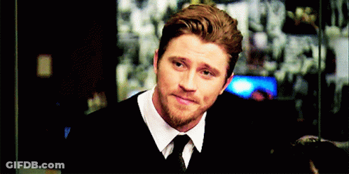 A Man With A Beard Wearing A White Shirt And Tie GIF