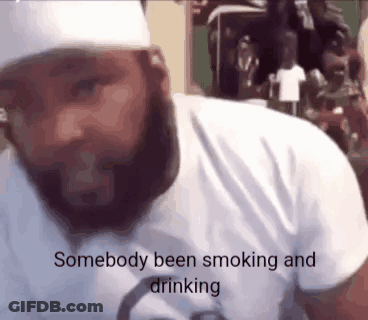 A Man With A Beard Wearing A White Shirt Says Somebody Been Smoking And Drinking . GIF