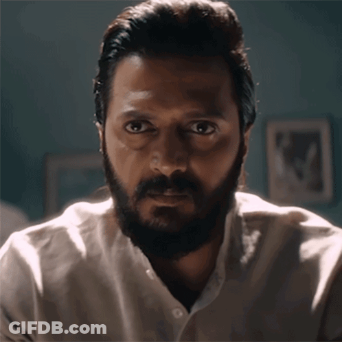 A Man With A Beard Wearing A White Shirt GIF