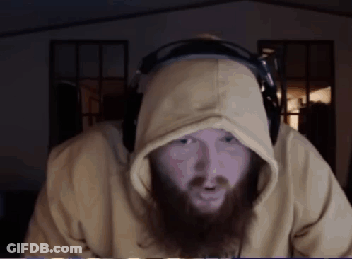 A Man With A Beard Wearing A Yellow Hoodie And Headphones GIF
