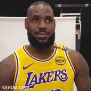 A Man With A Beard Wearing A Yellow Lakers Jersey . GIF