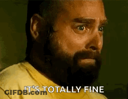A Man With A Beard Wearing A Yellow Shirt Says It 'S Totally Fine . GIF