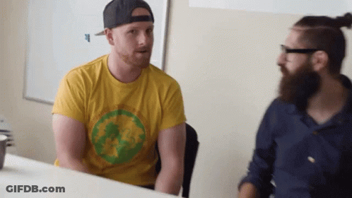 Man With Beard In Yellow Shirt With Green Circle GIF