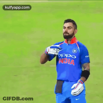 A Man With A Beard Wearing An Oppo India Shirt GIF