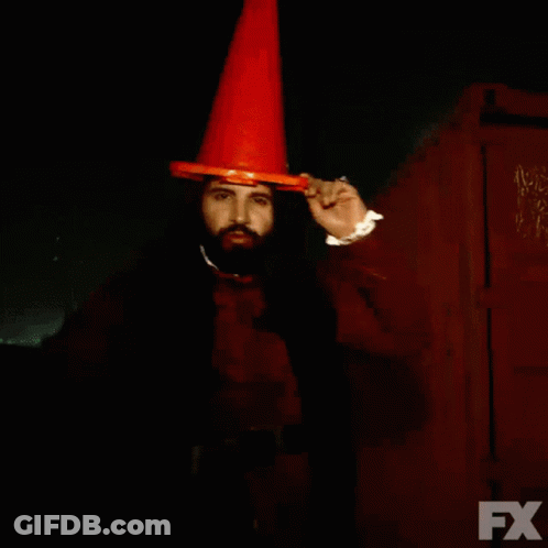A Man With A Beard Wearing An Orange Cone And The Words We Drank The Blood Of Some People On The Bottom GIF