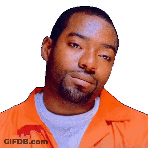 A Man With A Beard Wearing An Orange Shirt GIF