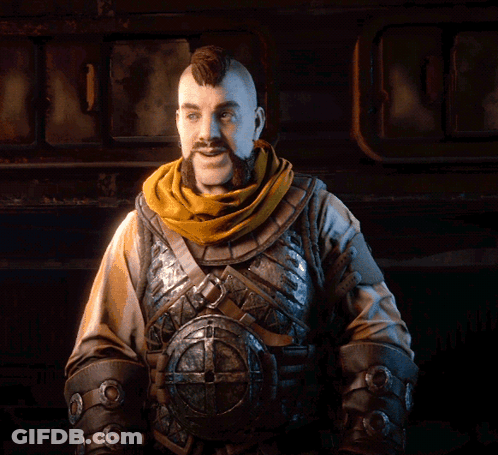 A Man With A Beard Wearing Armor And A Scarf Around His Neck GIF