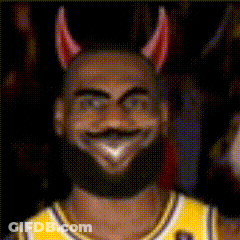 A Man With A Beard Wearing Devil Horns And A Yellow Jersey GIF