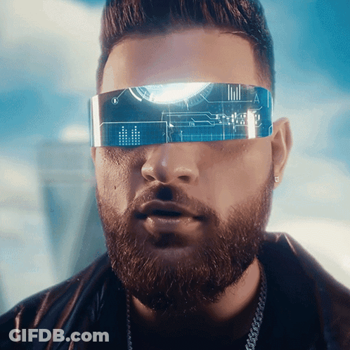 A Man With A Beard Wearing Futuristic Glasses With The Letter A On The Lens GIF