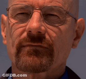 A Man With A Beard Wearing Glasses And A Blue Shirt GIF
