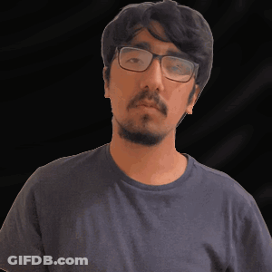 A Man With A Beard Wearing Glasses And A Blue Shirt GIF