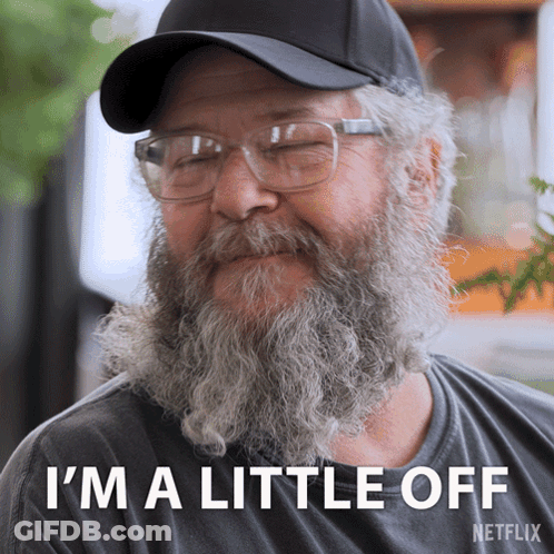 A Man With A Beard Wearing Glasses And A Hat Says I 'M A Little Off Netflix GIF