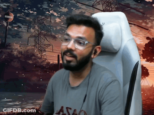 A Man With A Beard Wearing Glasses And A Shirt That Says Astao GIF