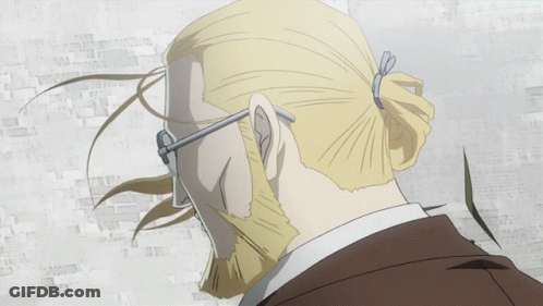 A Man With A Beard Wearing Glasses And A Suit GIF