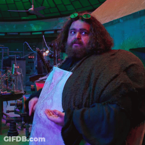 A Man With A Beard Wearing Goggles And A White Apron GIF