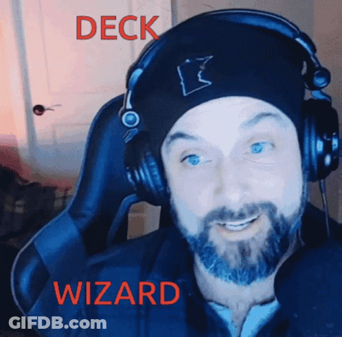 A Man With A Beard Wearing Headphones And A Beanie With The Word Deck Wizard On It GIF