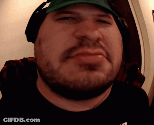 A Man With A Beard Wearing Headphones And A Hat GIF
