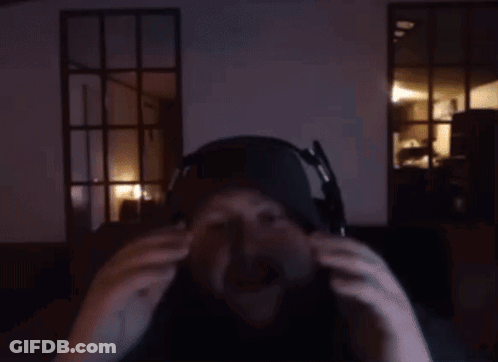 A Man With A Beard Wearing Headphones And A Hat GIF