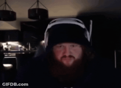 A Man With A Beard Wearing Headphones And A Hat Says Bro 'S The Sausage Sergeant GIF