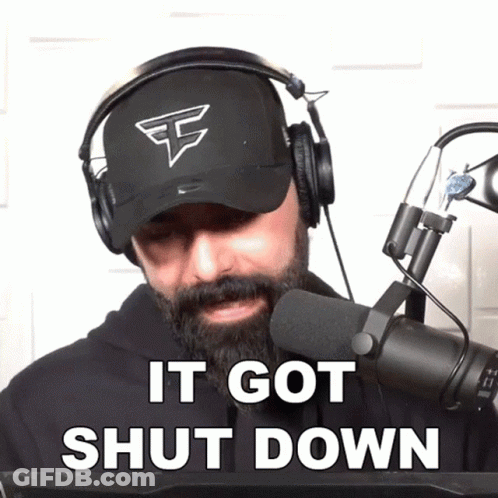 A Man With A Beard Wearing Headphones And A Hat Says It Got Shut Down GIF
