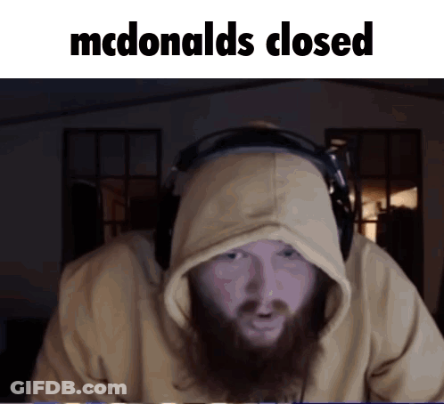 A Man With A Beard Wearing Headphones And A Hoodie Says Mcdonald 'S Closed GIF