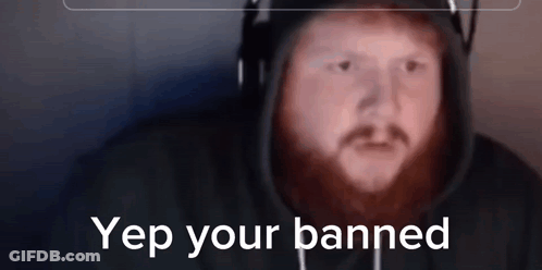 A Man With A Beard Wearing Headphones And A Hoodie With The Words Yep Your Banned On The Bottom GIF