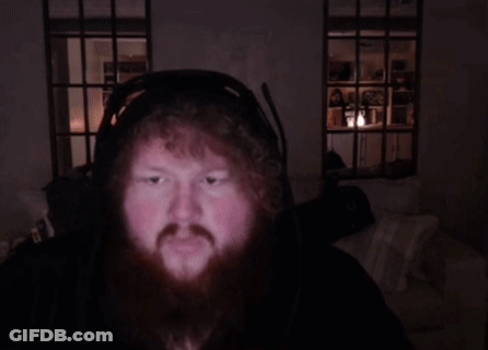 A Man With A Beard Wearing Headphones And A Microphone GIF