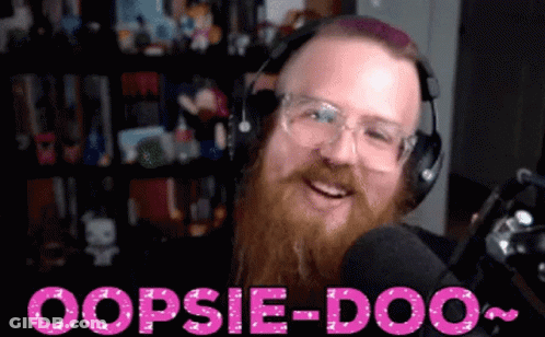 A Man With A Beard Wearing Headphones And Glasses Says Oopsie-Doo In Pink Letters GIF