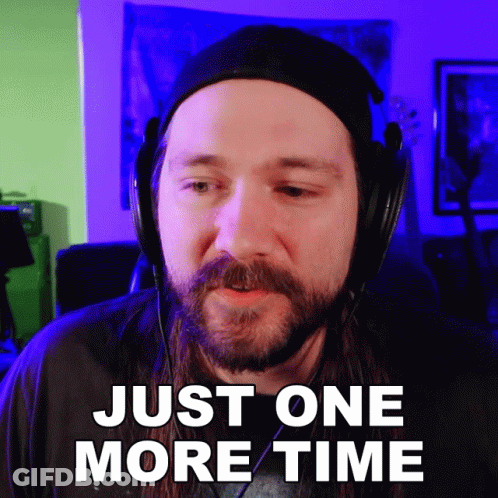 A Man With A Beard Wearing Headphones Says " Just One More Time " GIF