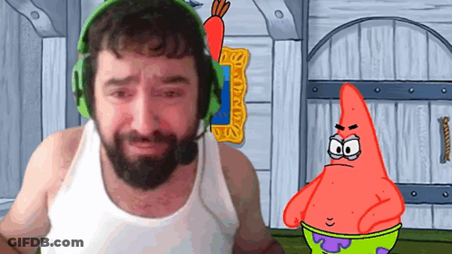 A Man With A Beard Wearing Headphones Stands Next To A Cartoon Character Patrick Star GIF