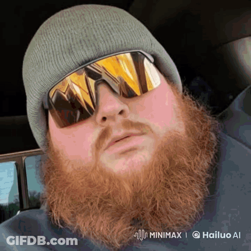 A Man With A Beard Wearing Sunglasses And A Beanie Is Being Animated By Hailuo Ai GIF