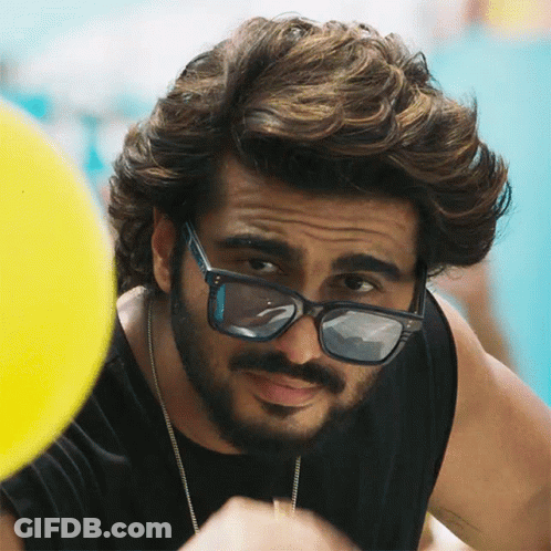 A Man With A Beard Wearing Sunglasses And A Black Shirt GIF