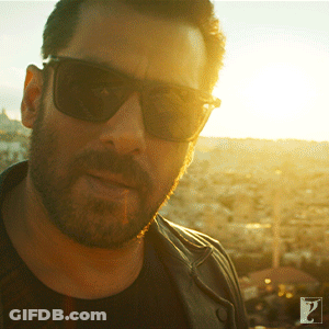 A Man With A Beard Wearing Sunglasses And A Black Shirt GIF