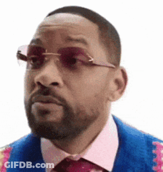 A Man With A Beard Wearing Sunglasses And A Blue Jacket And Tie . GIF