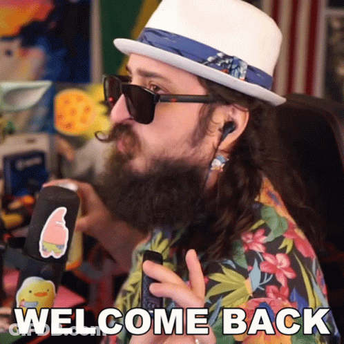 A Man With A Beard Wearing Sunglasses And A Hat Says " Welcome Back " GIF