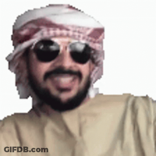 A Man With A Beard Wearing Sunglasses And A Scarf Around His Head . GIF