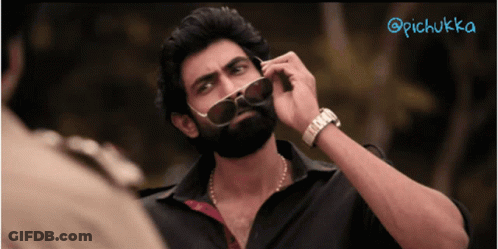 A Man With A Beard Wearing Sunglasses And A Watch With The Hashtag @Pichukka GIF