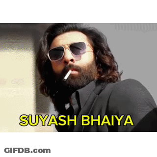 A Man With A Beard Wearing Sunglasses Is Smoking A Cigarette With The Words Suyasha Bhaiya Written Below Him GIF