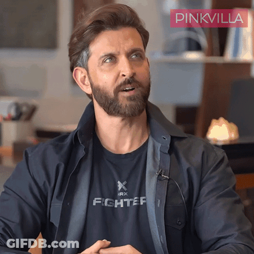A Man With A Beard Wears A Black Shirt That Says Fighter GIF