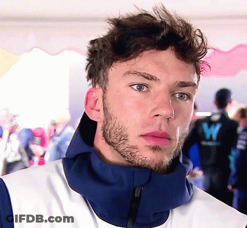 A Man With A Beard Wears A Blue Jacket With The Letter W On The Back GIF