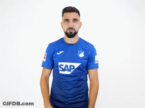 A Man With A Beard Wears A Blue Shirt That Says Sap GIF