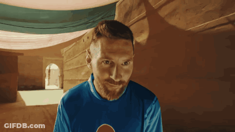 A Man With A Beard Wears A Blue Shirt With A Pepsi Logo On It GIF