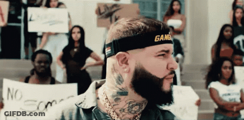 A Man With A Beard Wears A Headband That Says Gangsta On It GIF