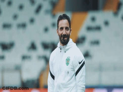A Man With A Beard Wears A Nike Jacket GIF