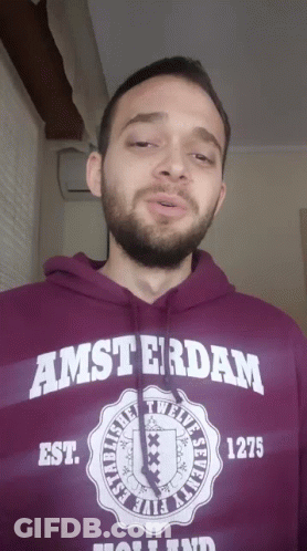 A Man With A Beard Wears A Purple Amsterdam Hoodie GIF