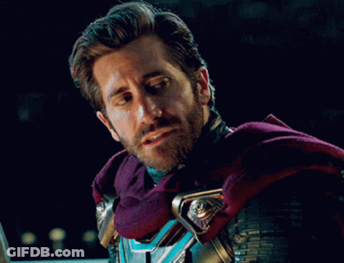 A Man With A Beard Wears A Purple Cape GIF